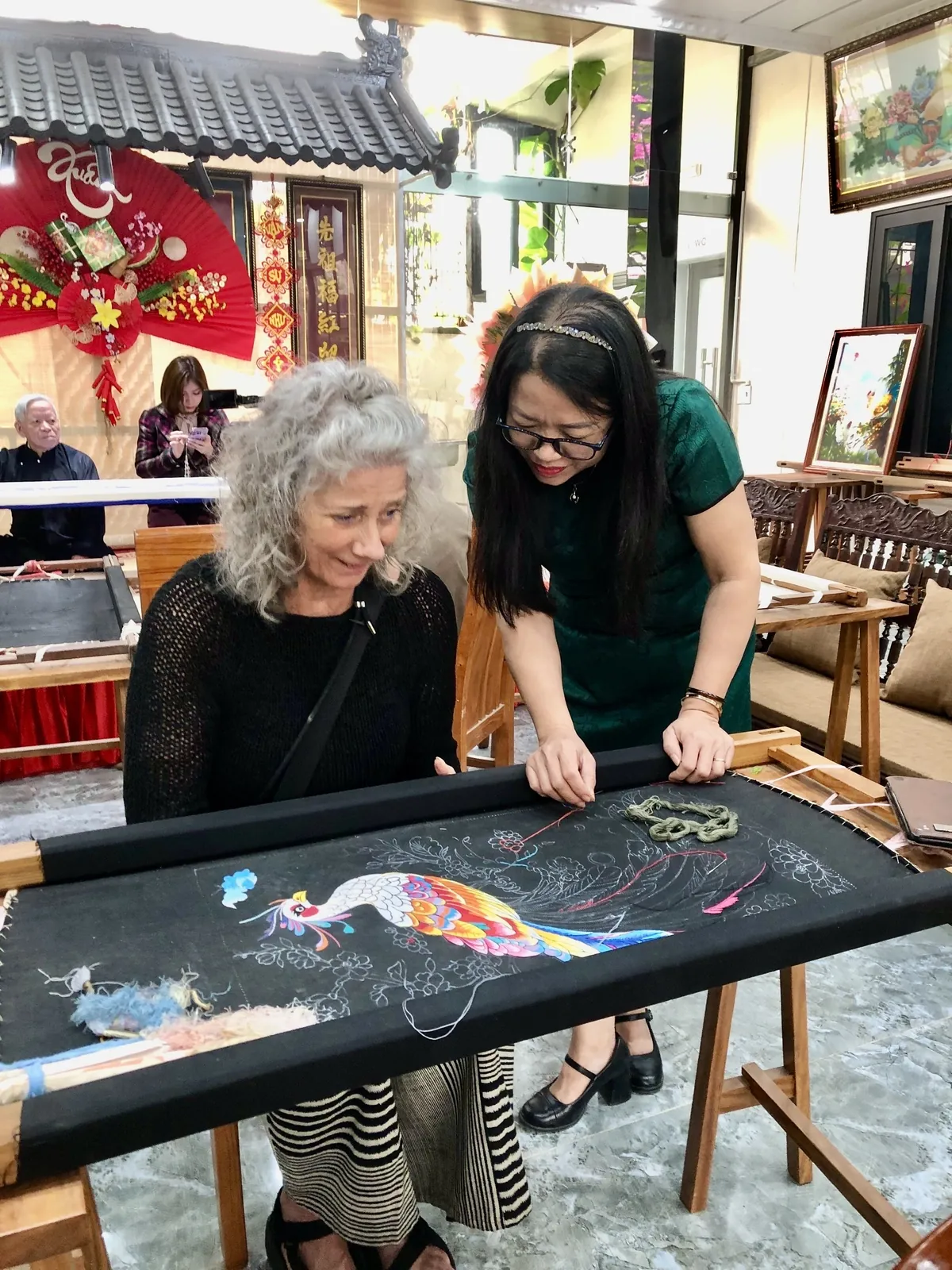 Embroidery student learning stitches at an artisan-led lesson